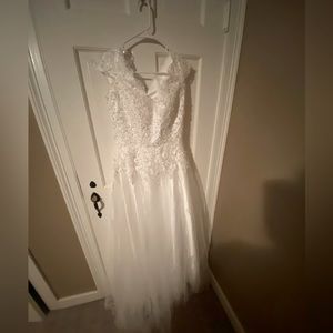 Brand new wedding dress. Did not fit. Cannot return.